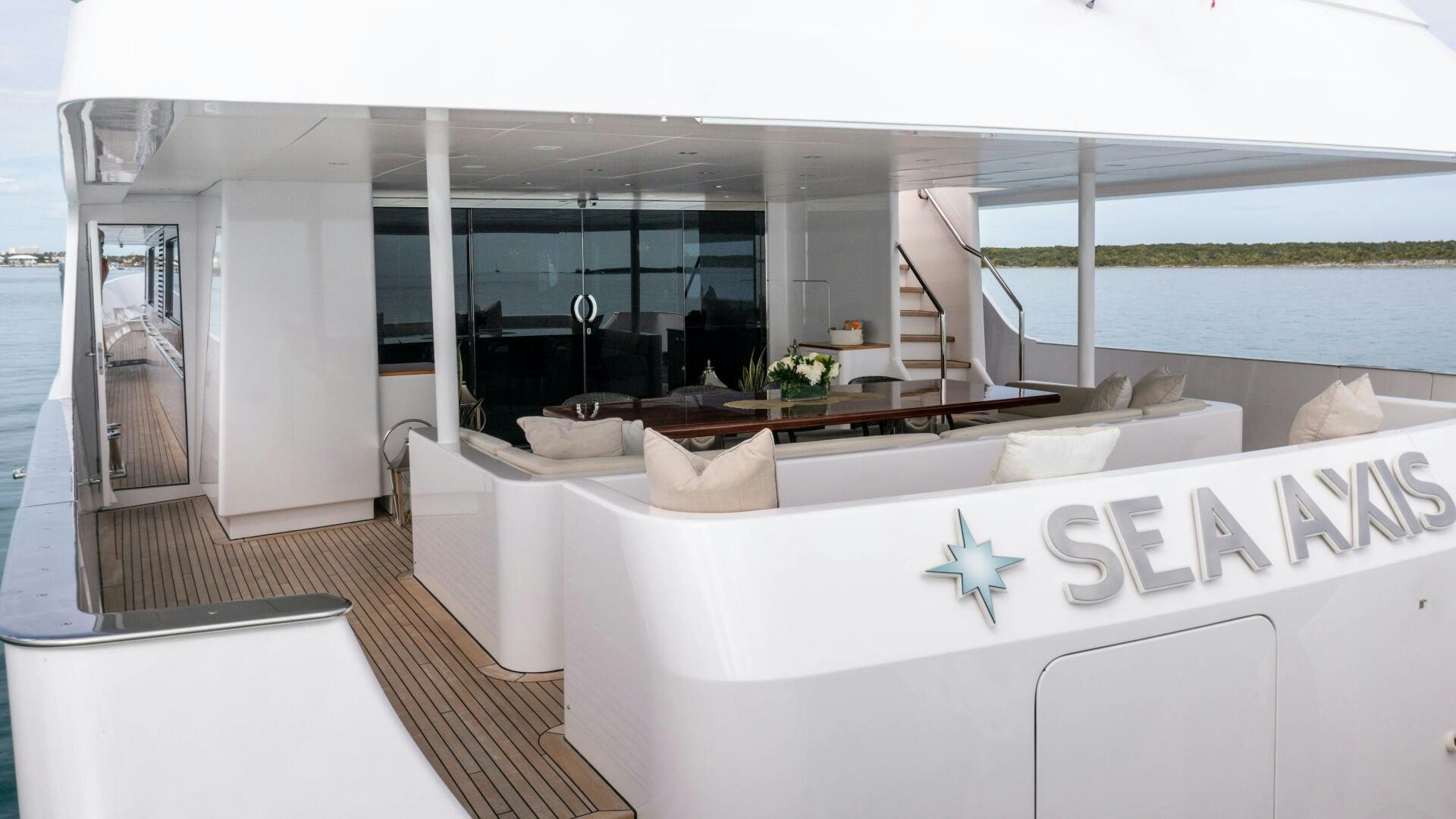 a room with a large white bed aboard SEA AXIS Yacht for Sale