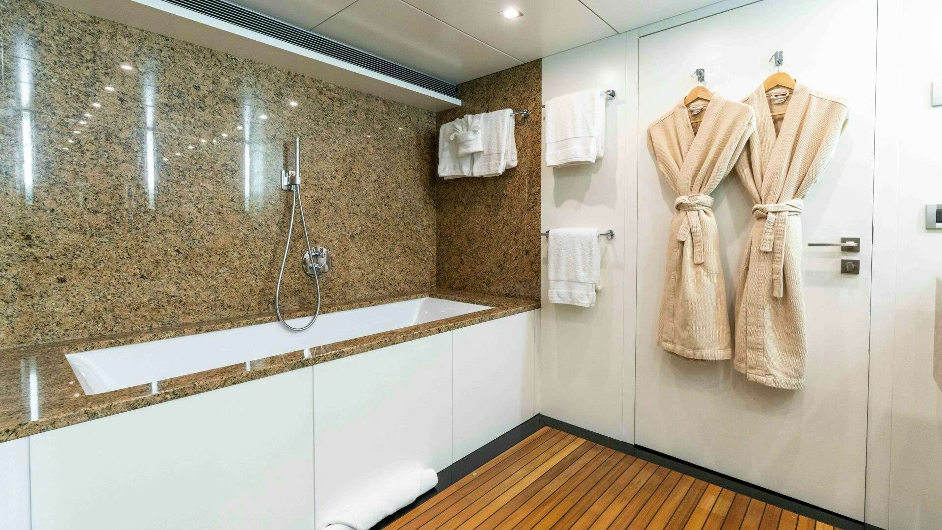 a bathroom with a sink and a mirror aboard SEA AXIS Yacht for Sale