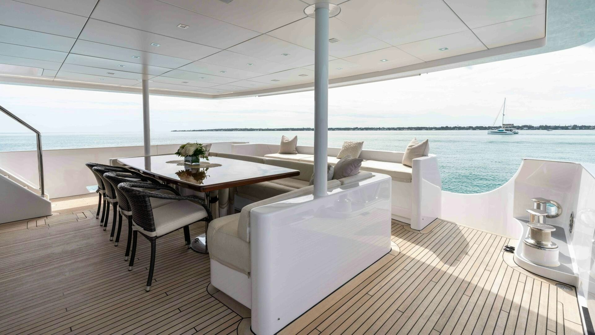 a room with a table and chairs aboard SEA AXIS Yacht for Sale