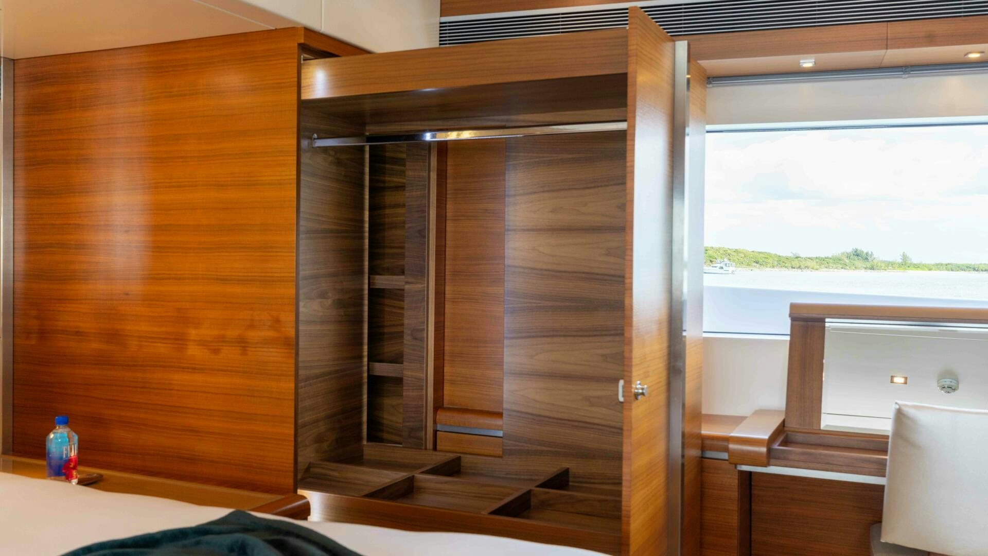 a room with a window and a desk aboard SEA AXIS Yacht for Sale