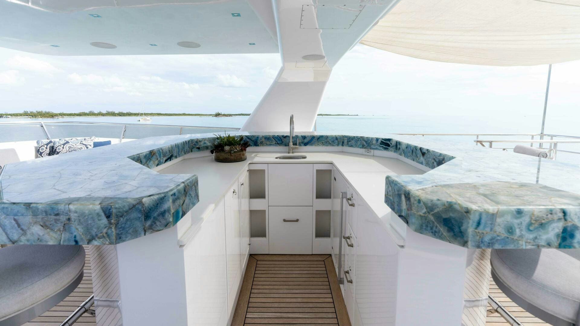 a large white room with a wooden floor and a wooden floor aboard SEA AXIS Yacht for Sale