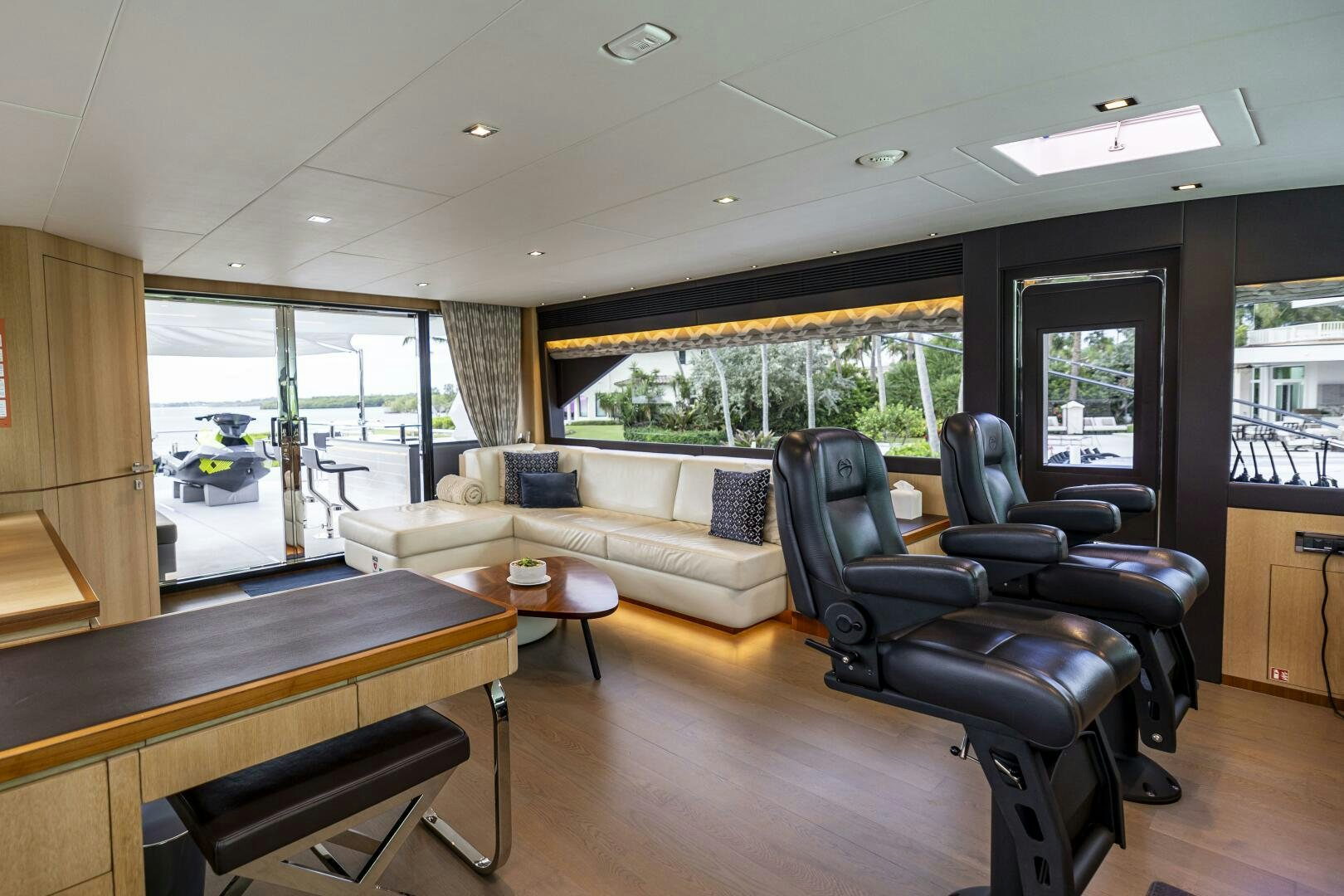 a living room with a couch and a table aboard AQUA LIFE Yacht for Sale