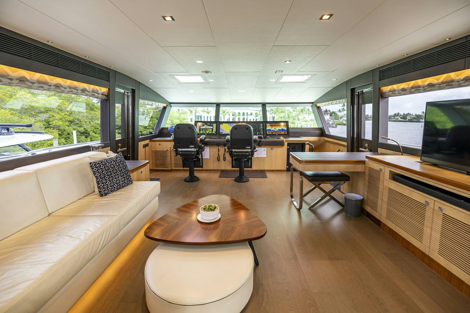 a room with a table and chairs aboard AQUA LIFE Yacht for Sale