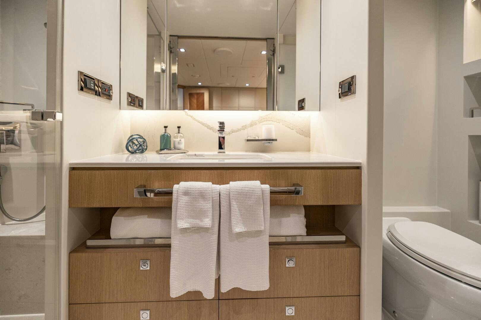 a bathroom with a mirror and a sink aboard AQUA LIFE Yacht for Sale