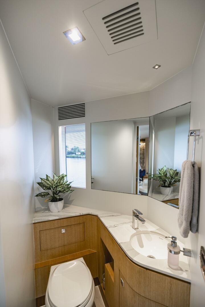 a bathroom with a sink and a toilet aboard AQUA LIFE Yacht for Sale