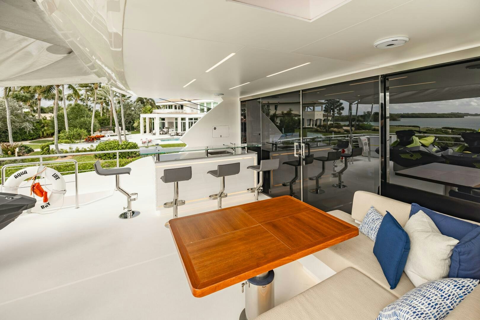 a room with a table and chairs aboard AQUA LIFE Yacht for Sale