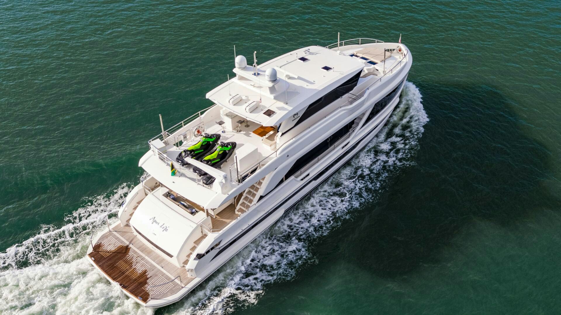 a white boat on the water aboard AQUA LIFE Yacht for Sale