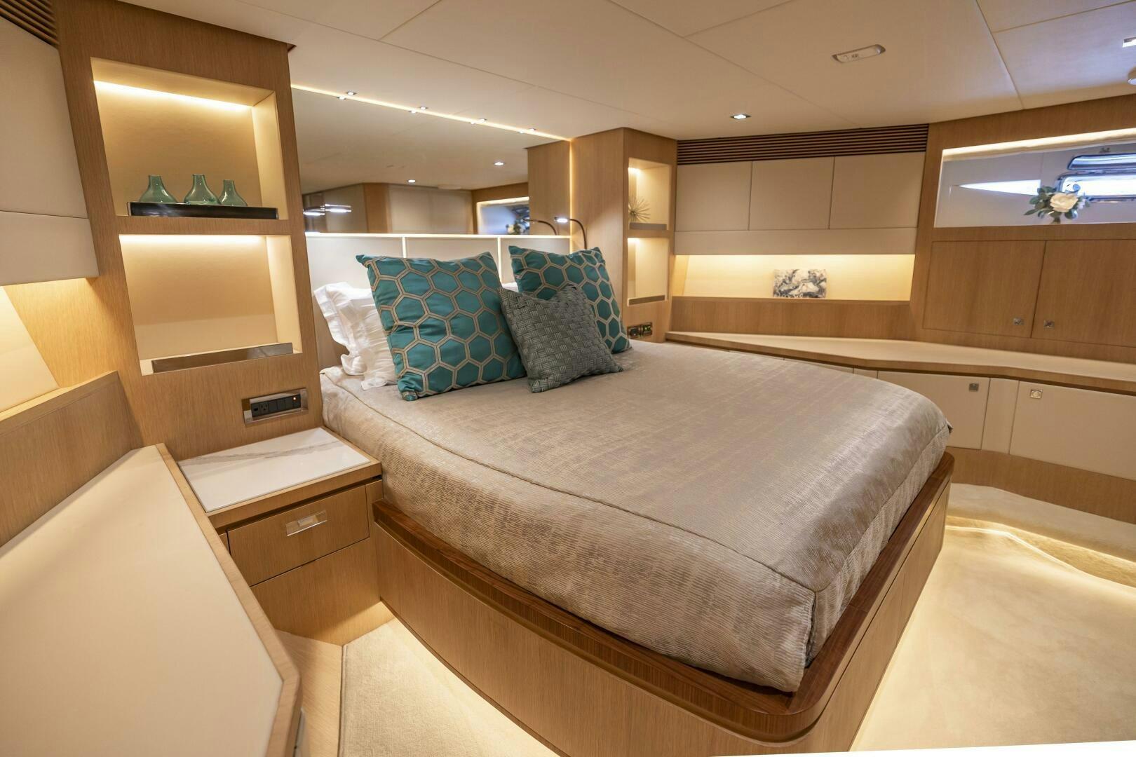 a bedroom with a bed and a desk aboard AQUA LIFE Yacht for Sale