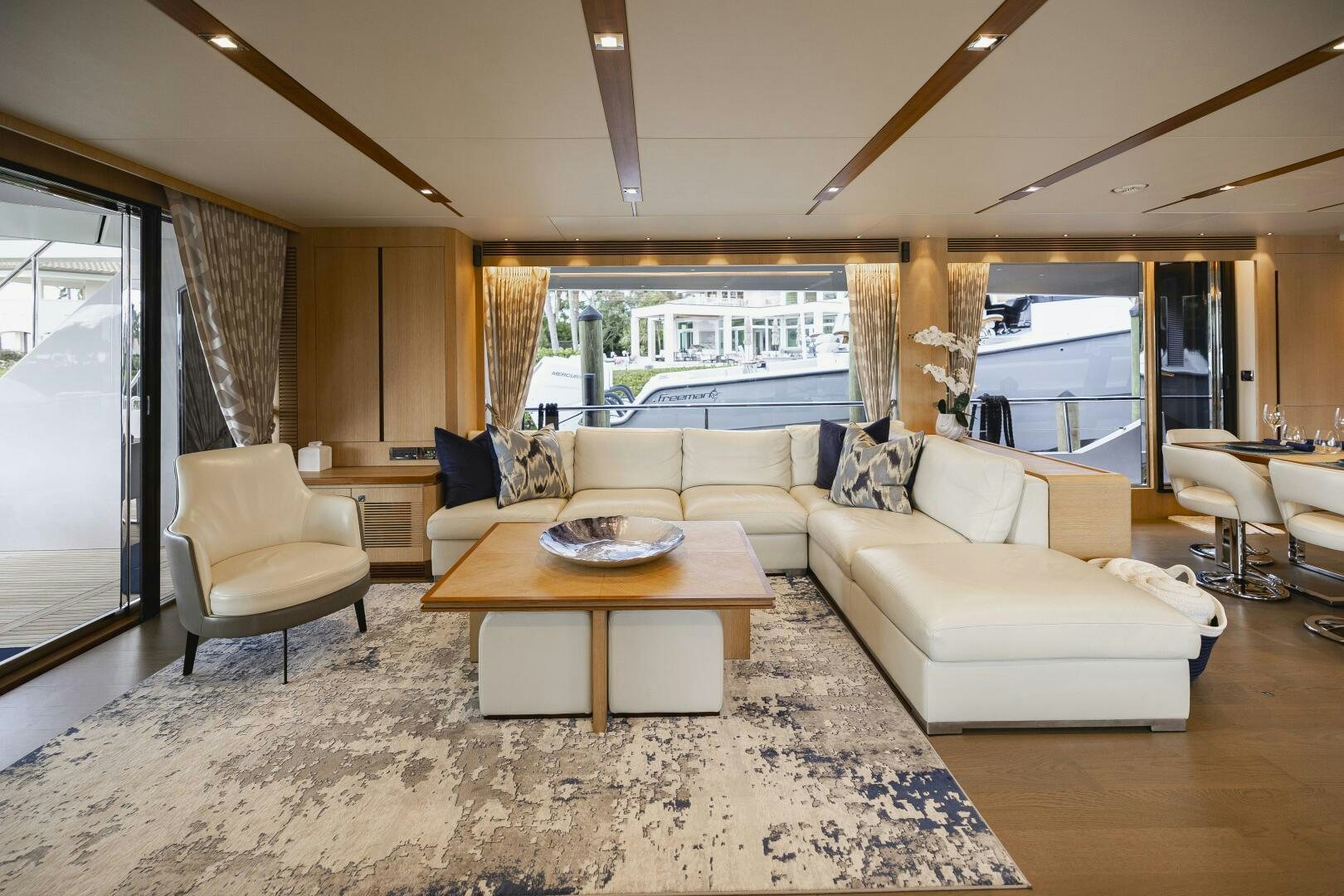 a living room with a large window aboard AQUA LIFE Yacht for Sale