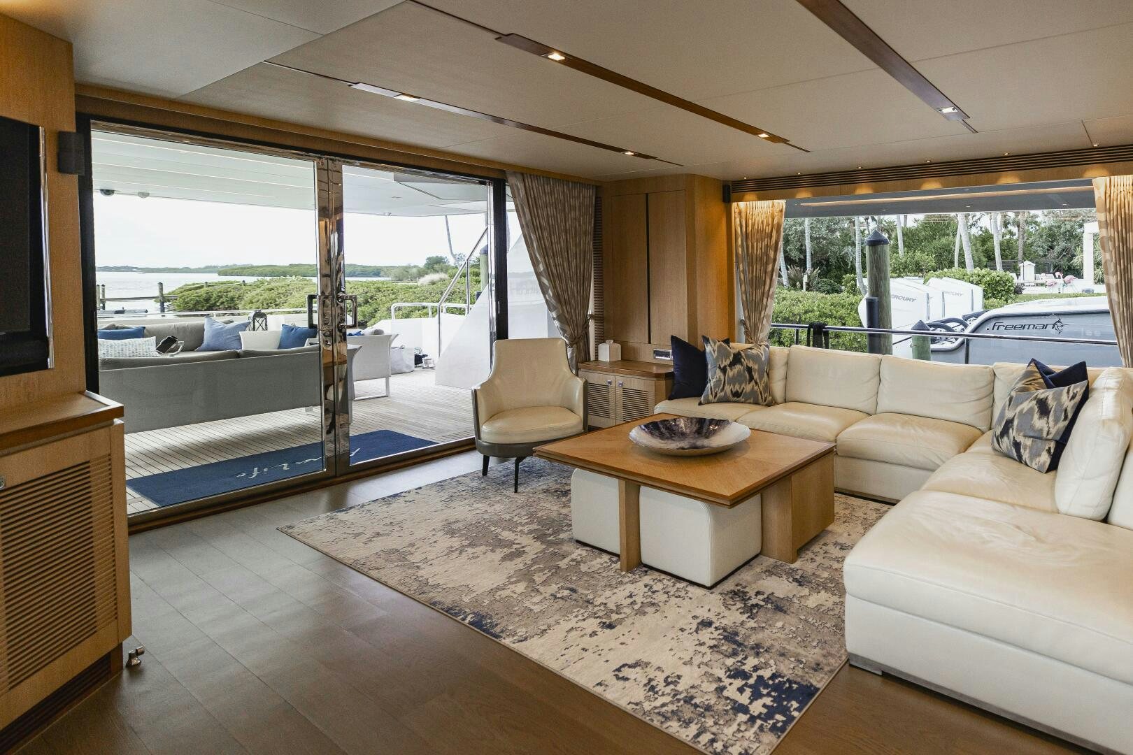 a living room with a large window aboard AQUA LIFE Yacht for Sale