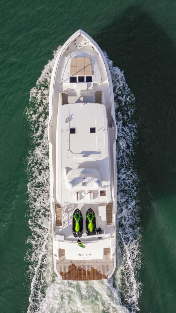 a white boat on the water aboard AQUA LIFE Yacht for Sale