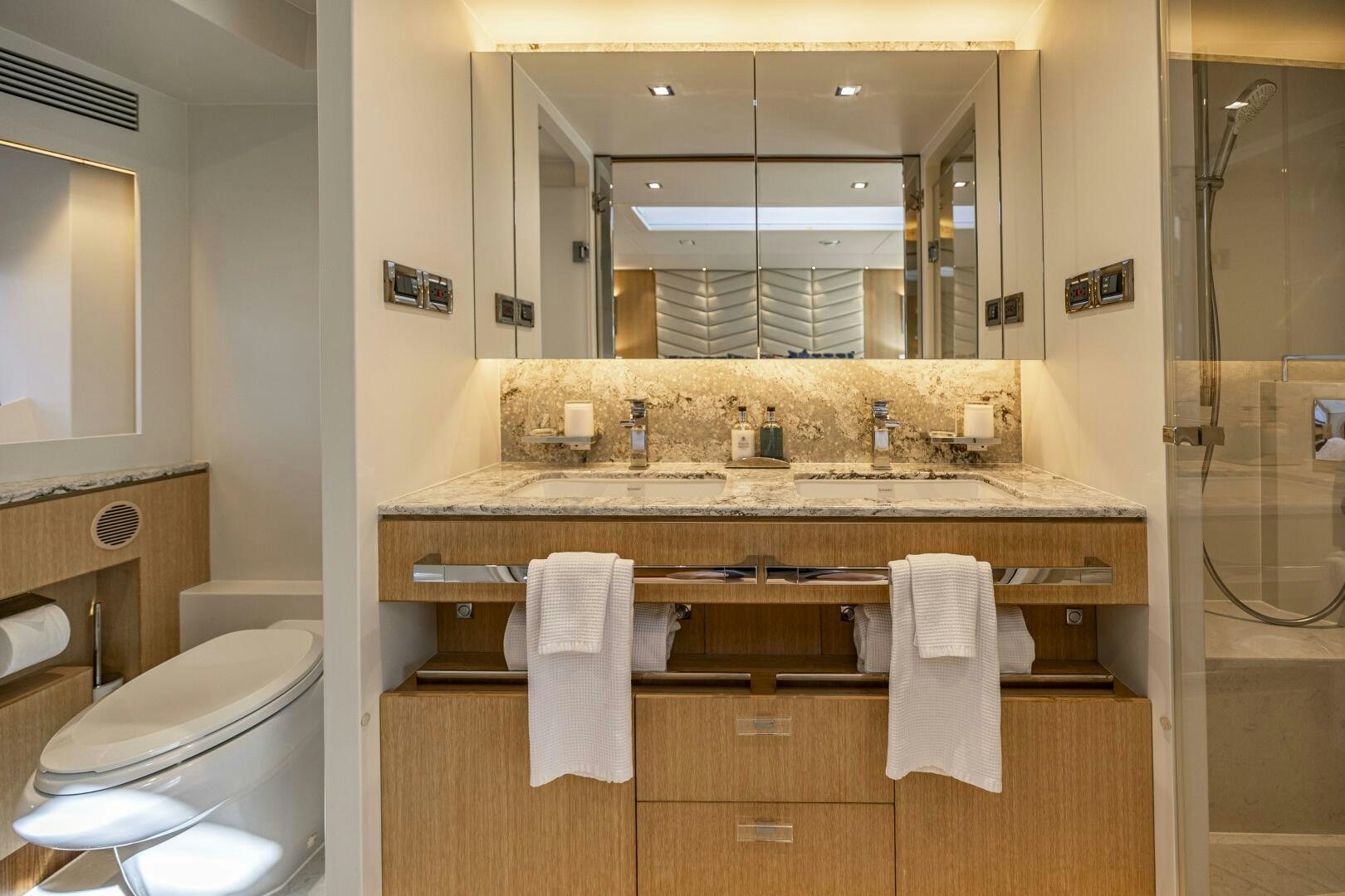 a bathroom with a large mirror aboard AQUA LIFE Yacht for Sale