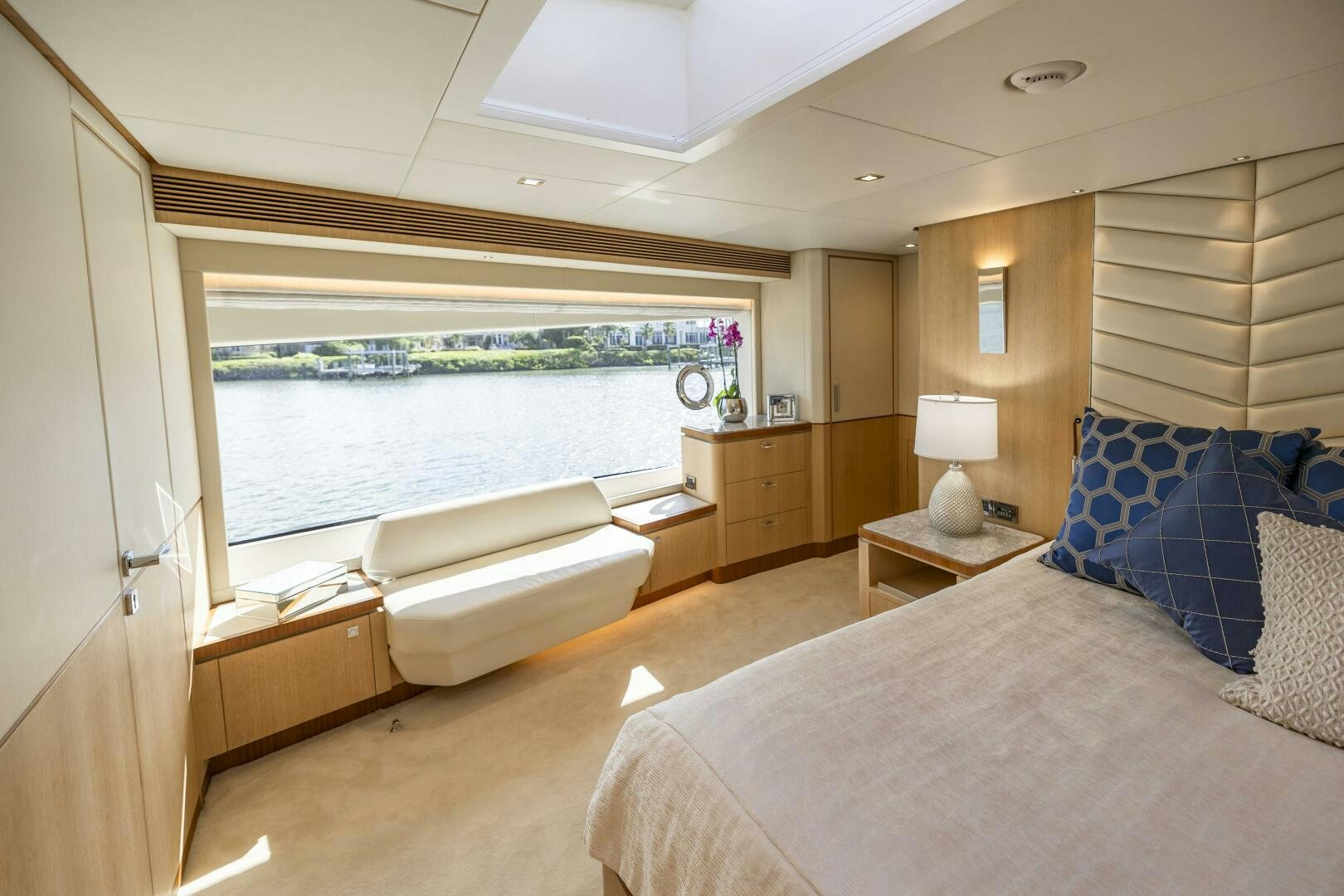 a bedroom with a large window aboard AQUA LIFE Yacht for Sale