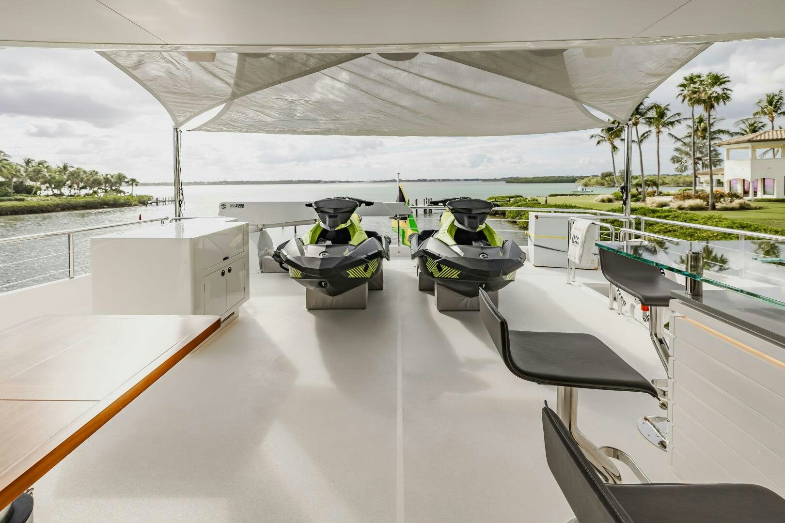 a room with a pool table and chairs aboard AQUA LIFE Yacht for Sale