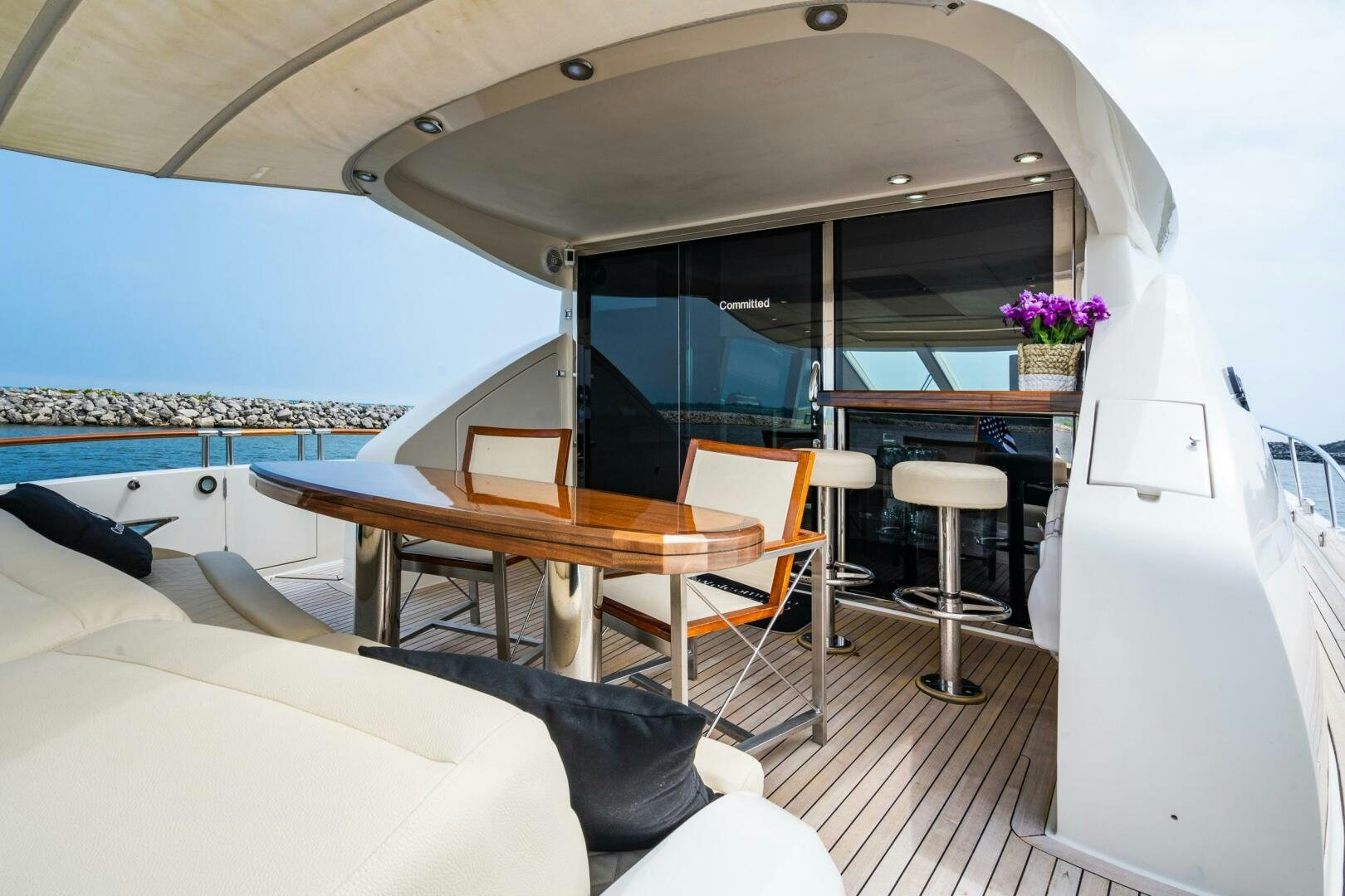 a room with a table and chairs aboard COMMITTED Yacht for Sale