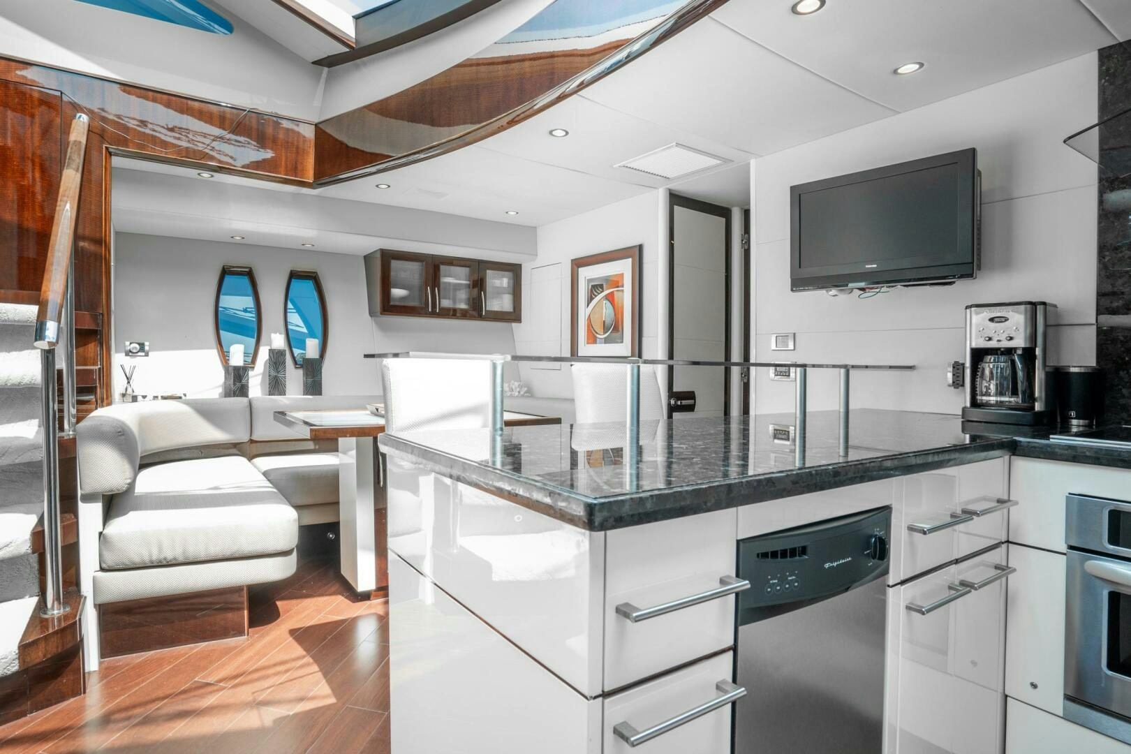 a kitchen with a large island aboard COMMITTED Yacht for Sale