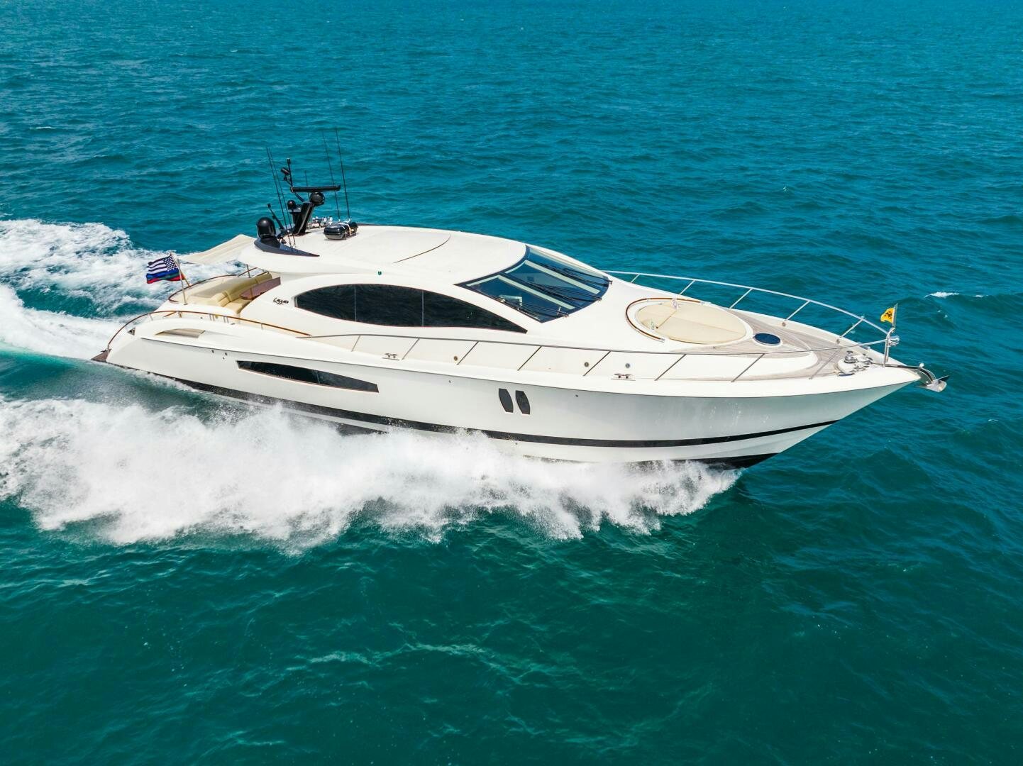 a white yacht on the water aboard COMMITTED Yacht for Sale