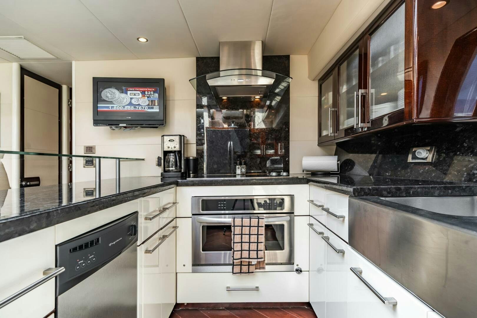 a kitchen with a stove and oven aboard COMMITTED Yacht for Sale