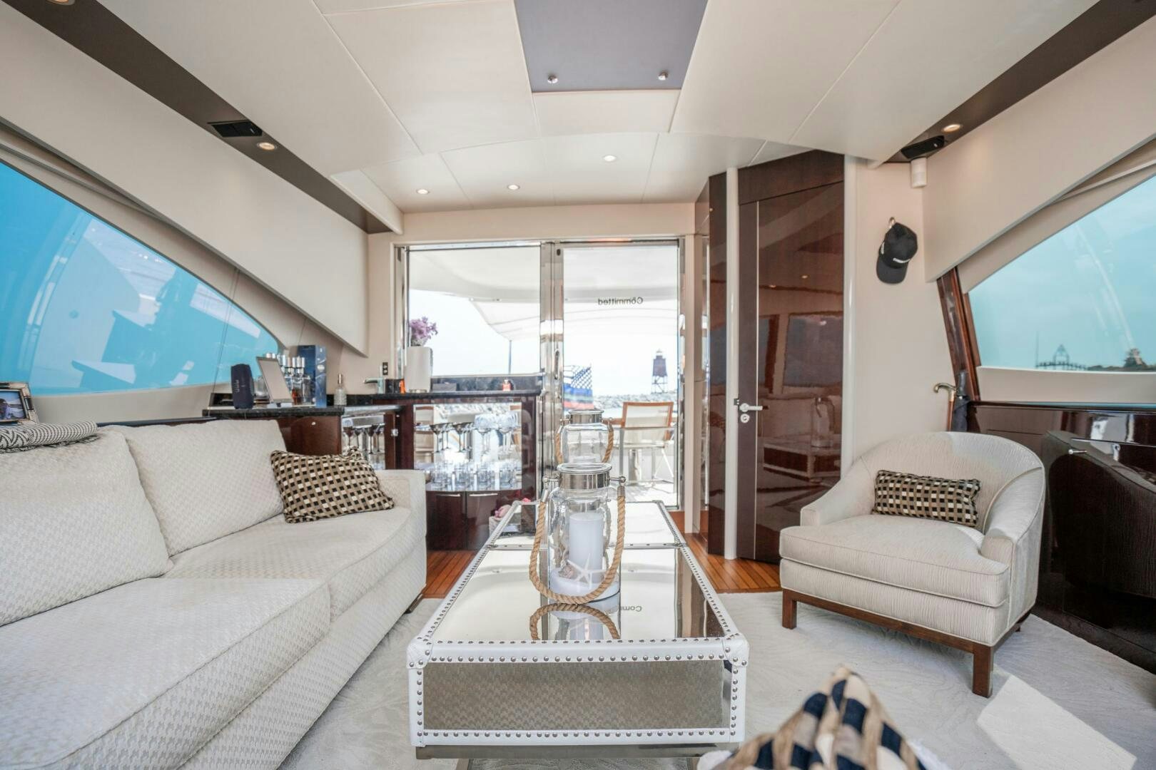 a living room with a glass table aboard COMMITTED Yacht for Sale