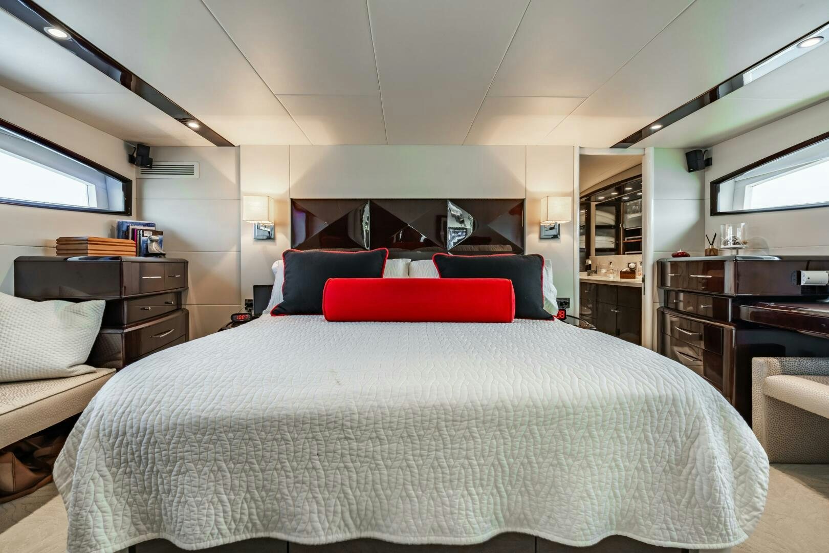 a bedroom with a bed and a desk aboard COMMITTED Yacht for Sale