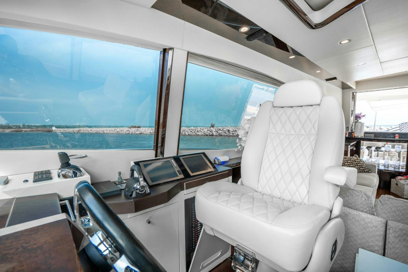 a room with a view of the city and the ocean aboard COMMITTED Yacht for Sale