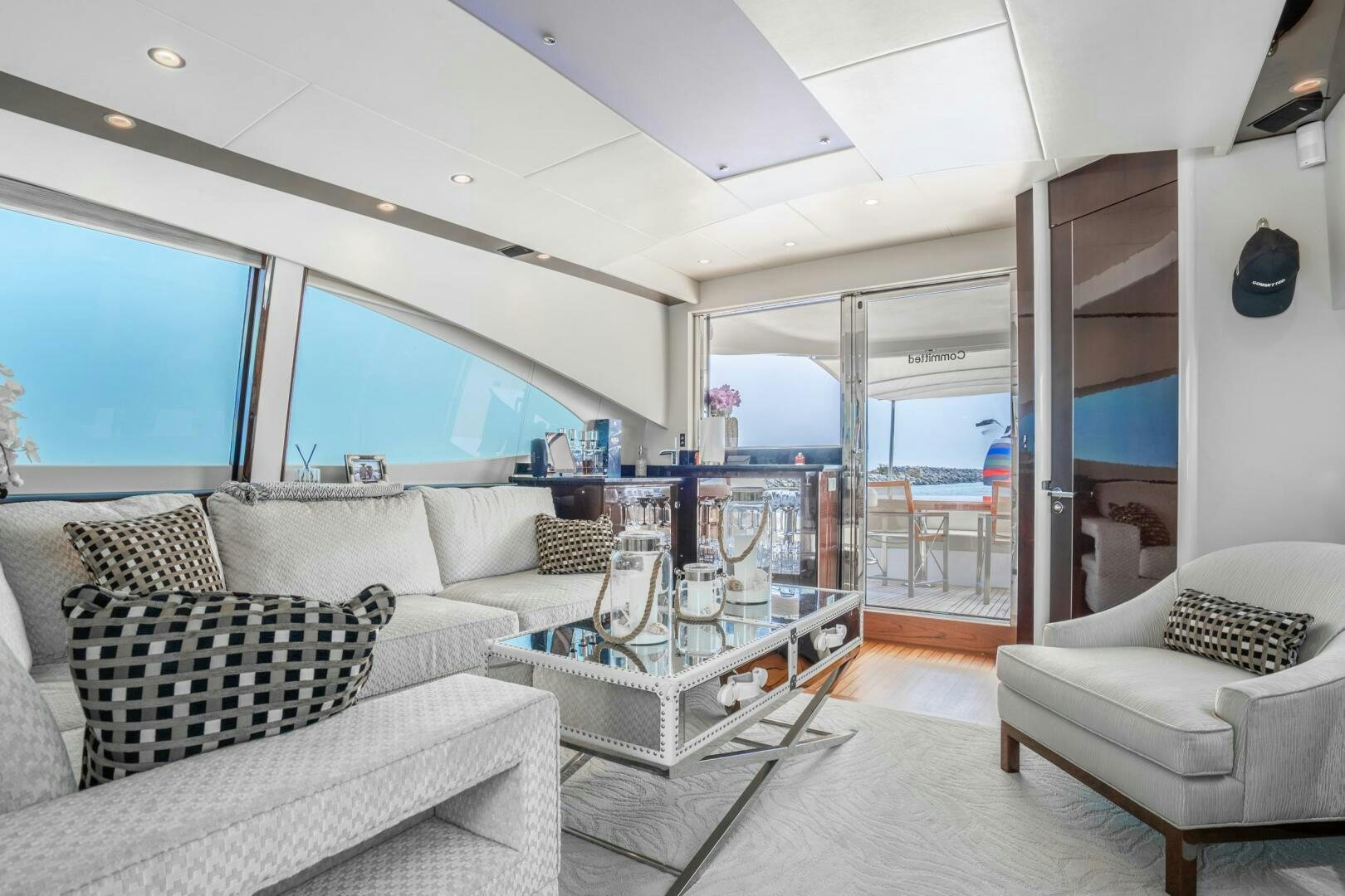 a living room with a large window aboard COMMITTED Yacht for Sale