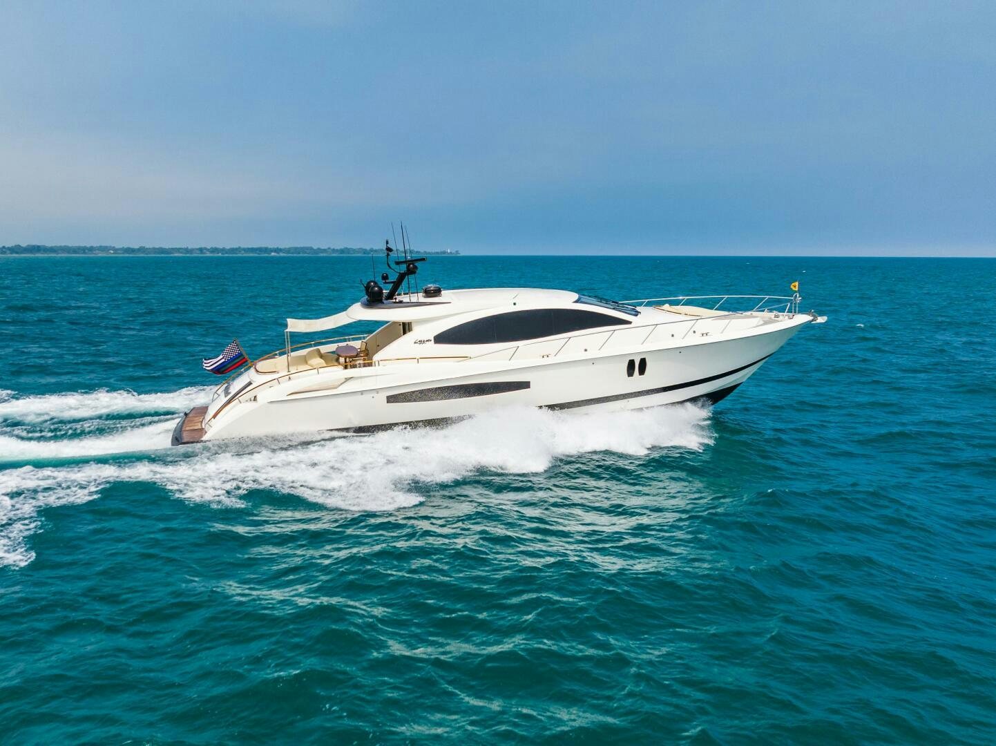 a white yacht in the ocean aboard COMMITTED Yacht for Sale