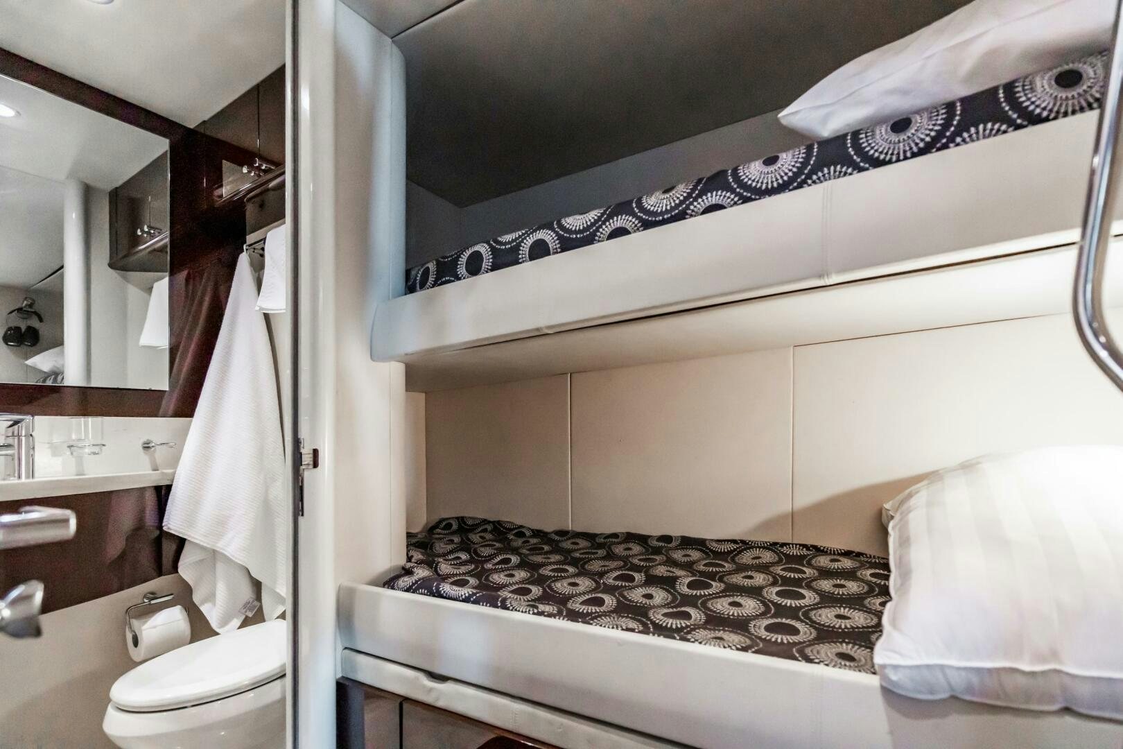 a bathroom with a large mirror aboard COMMITTED Yacht for Sale