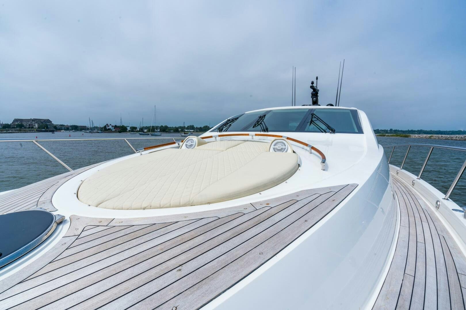 a white car on a dock aboard COMMITTED Yacht for Sale