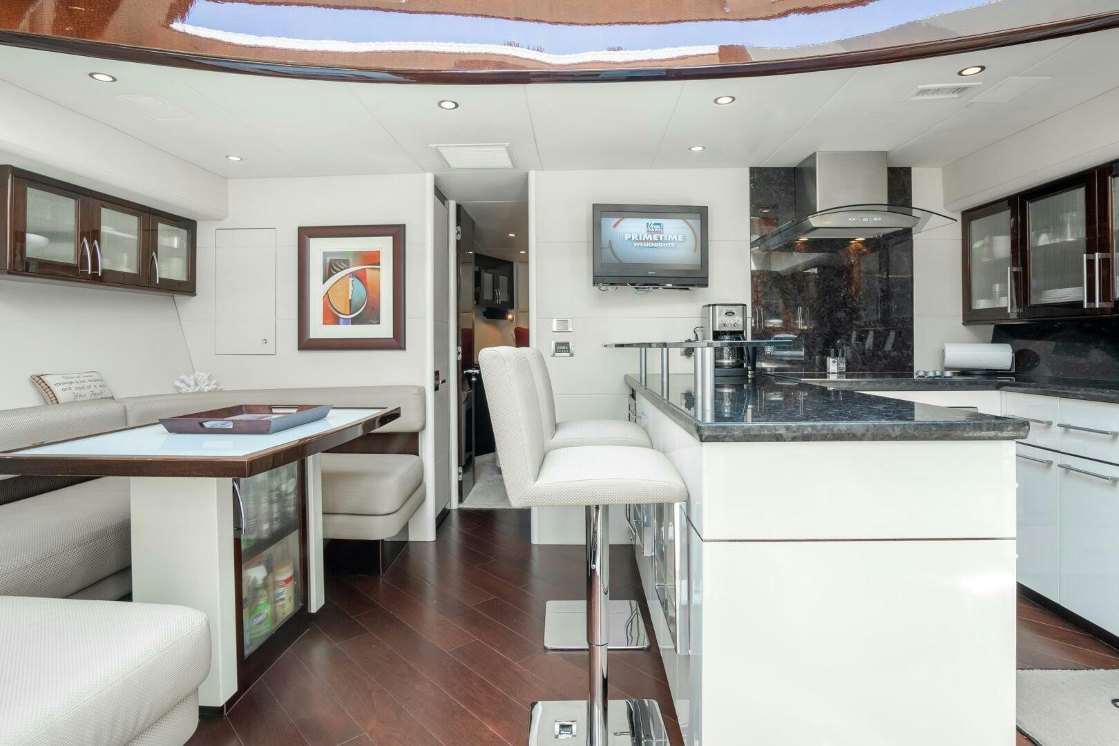 a kitchen with a table and chairs aboard COMMITTED Yacht for Sale