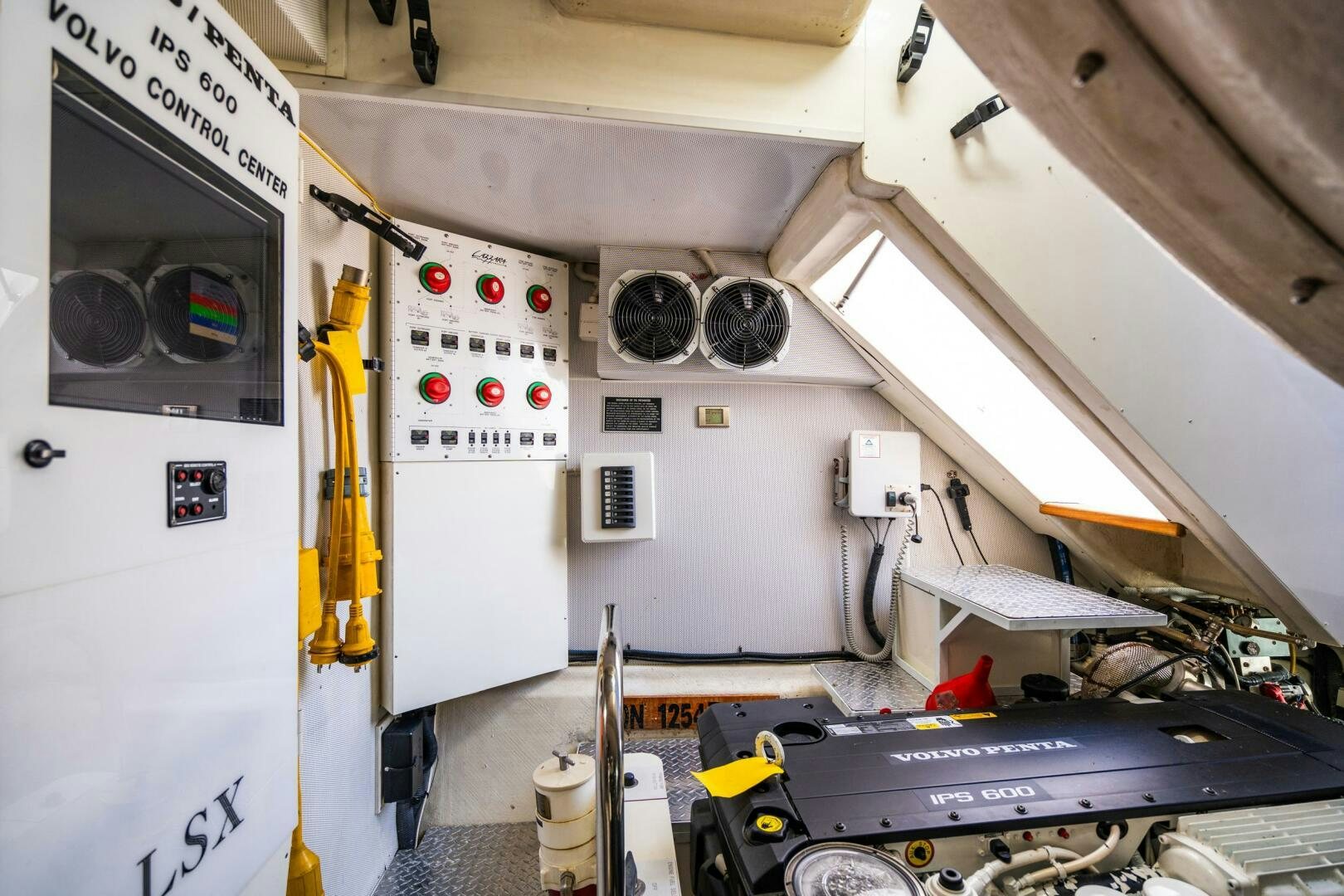 a white vehicle with a black frame aboard COMMITTED Yacht for Sale
