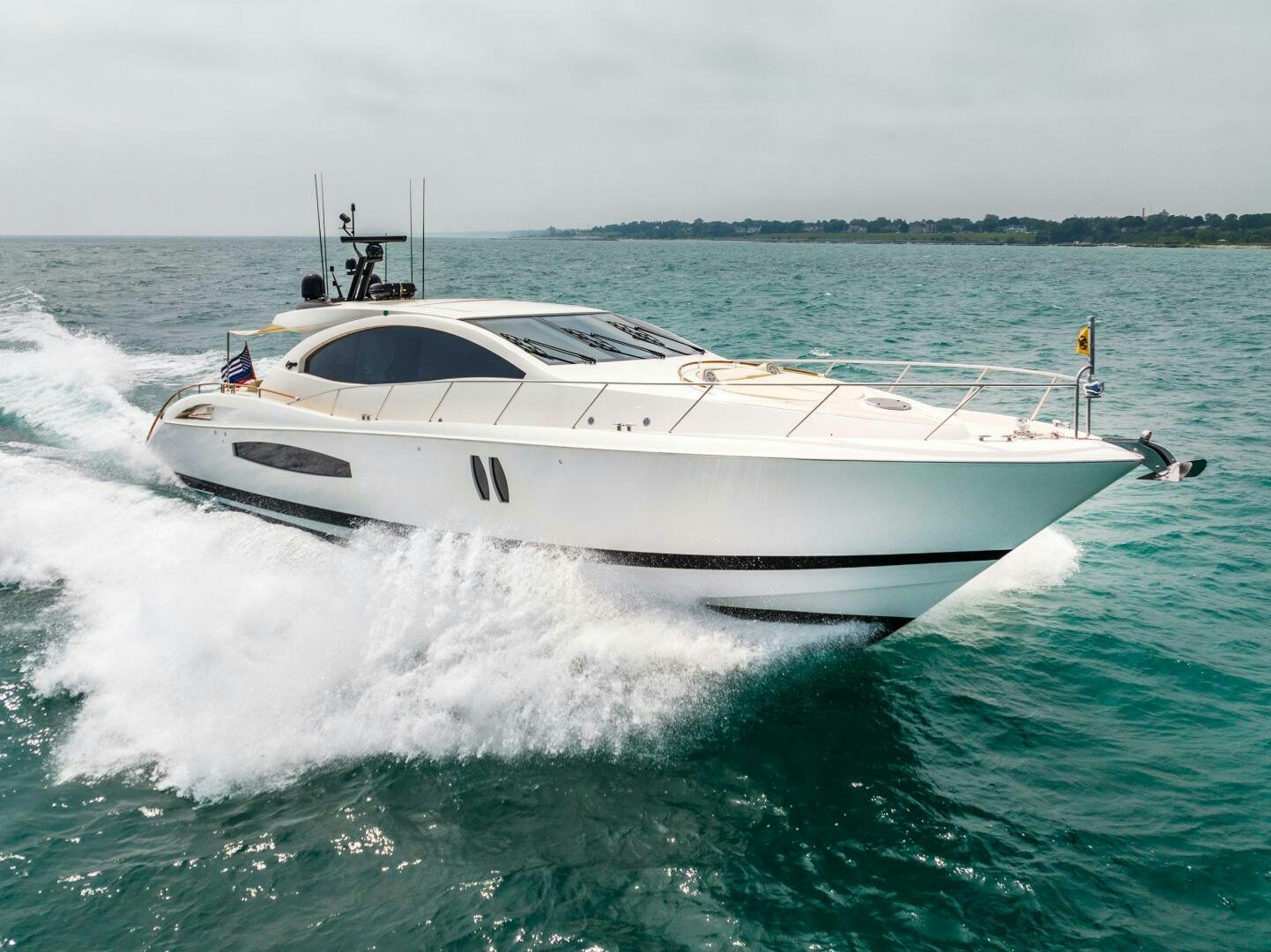 a white boat on water aboard COMMITTED Yacht for Sale