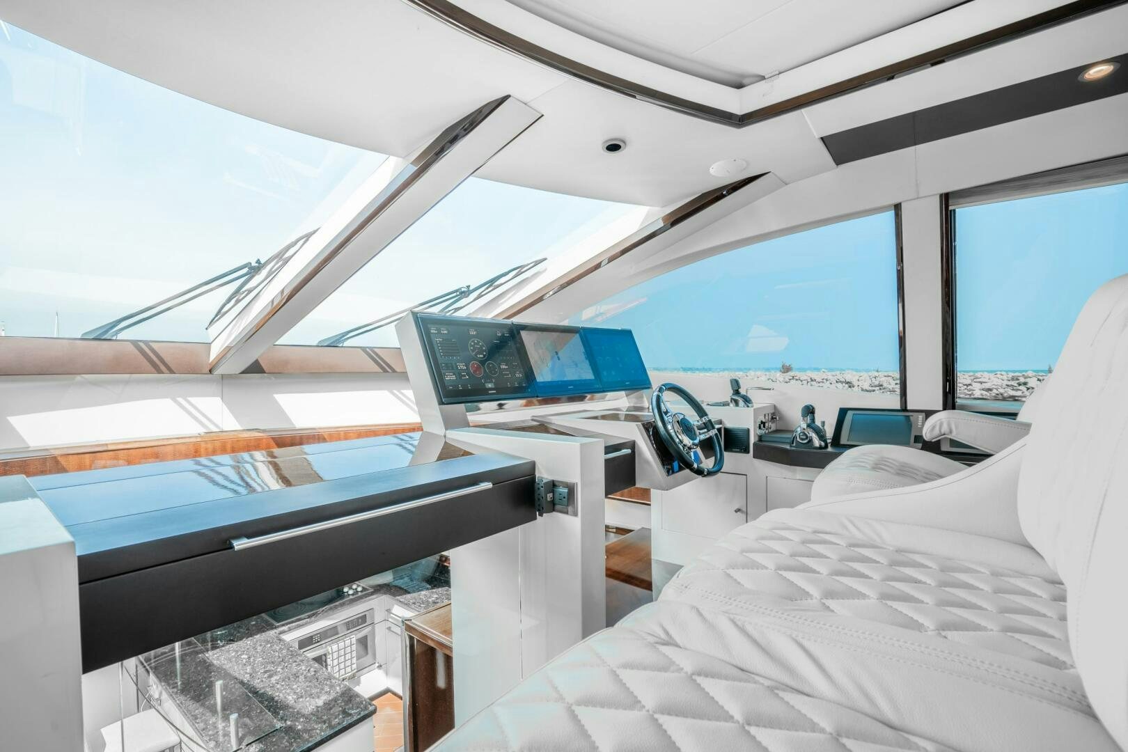 a room with a bed and a desk aboard COMMITTED Yacht for Sale
