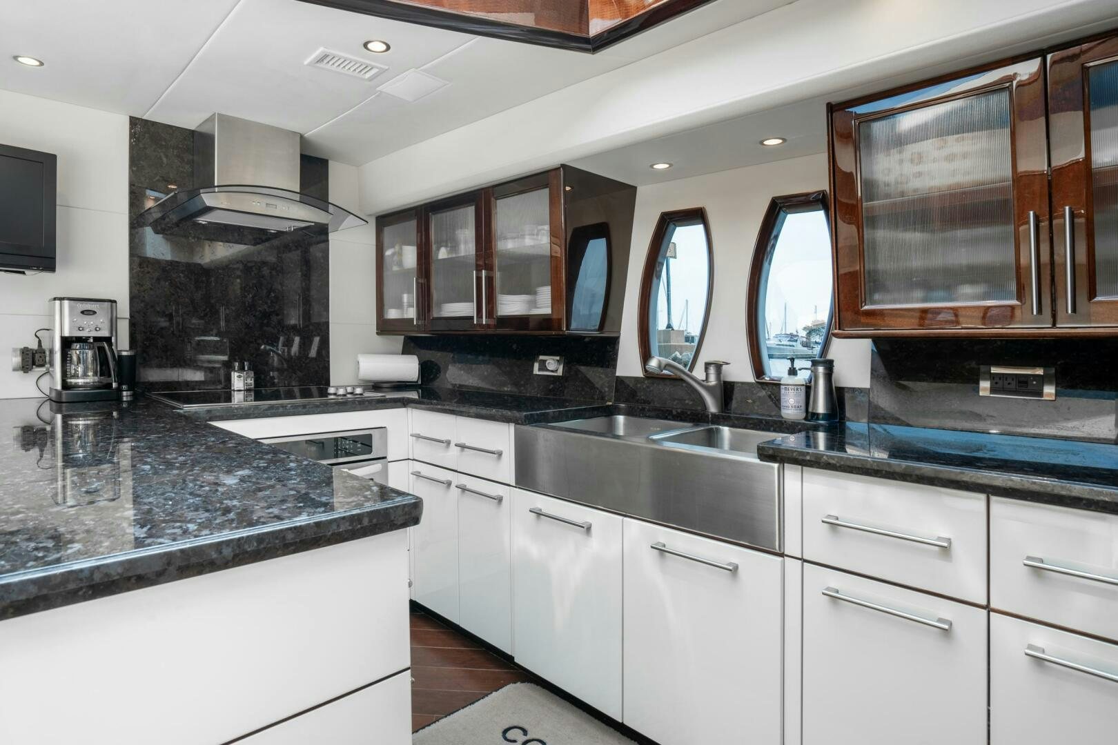 a kitchen with a large island aboard COMMITTED Yacht for Sale