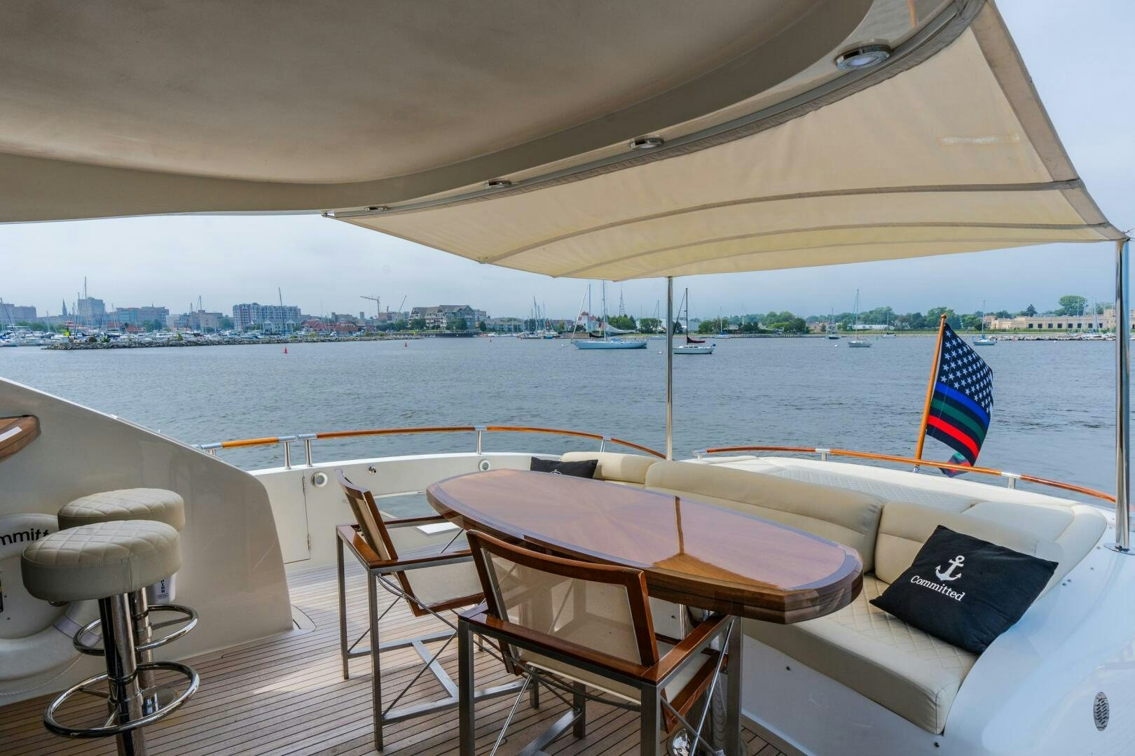 a table and chairs on a boat aboard COMMITTED Yacht for Sale