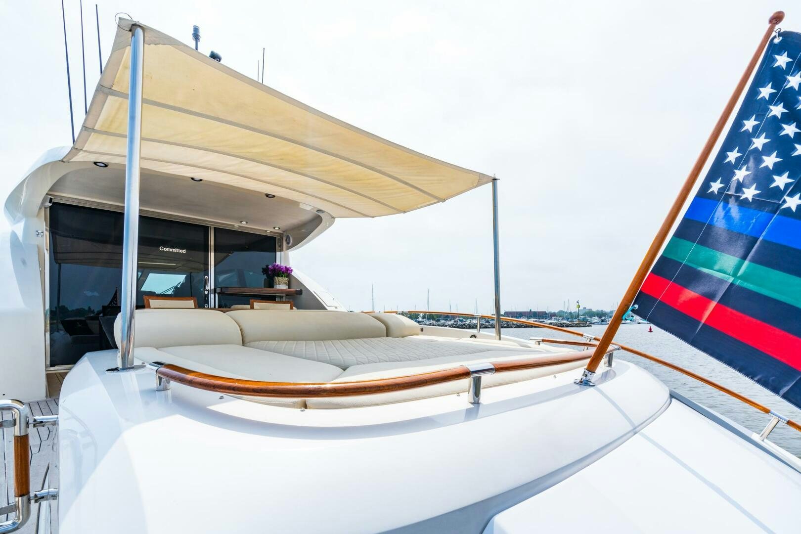 a large white tent with a blue and red striped tent aboard COMMITTED Yacht for Sale