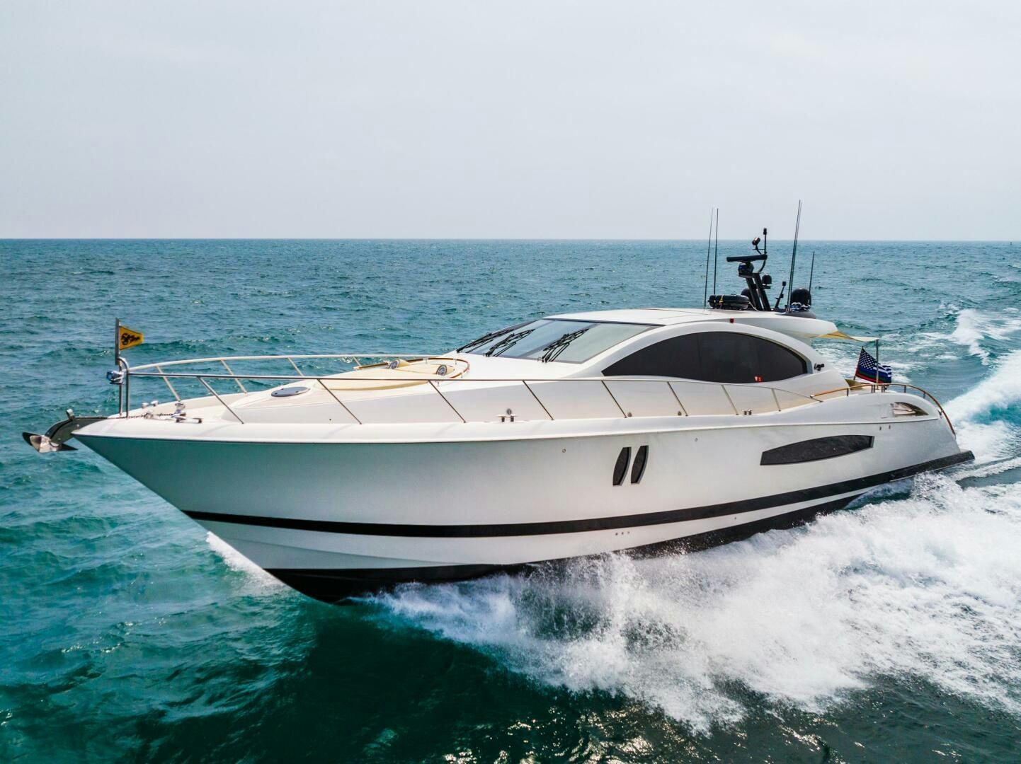 a white yacht on the water aboard COMMITTED Yacht for Sale