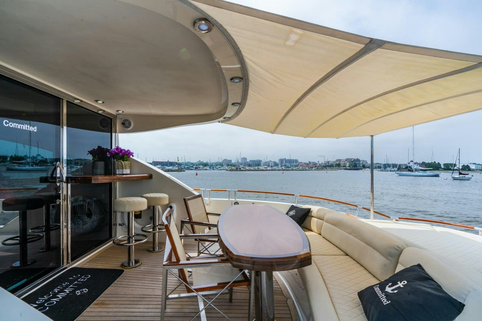 a boat with a table and chairs aboard COMMITTED Yacht for Sale