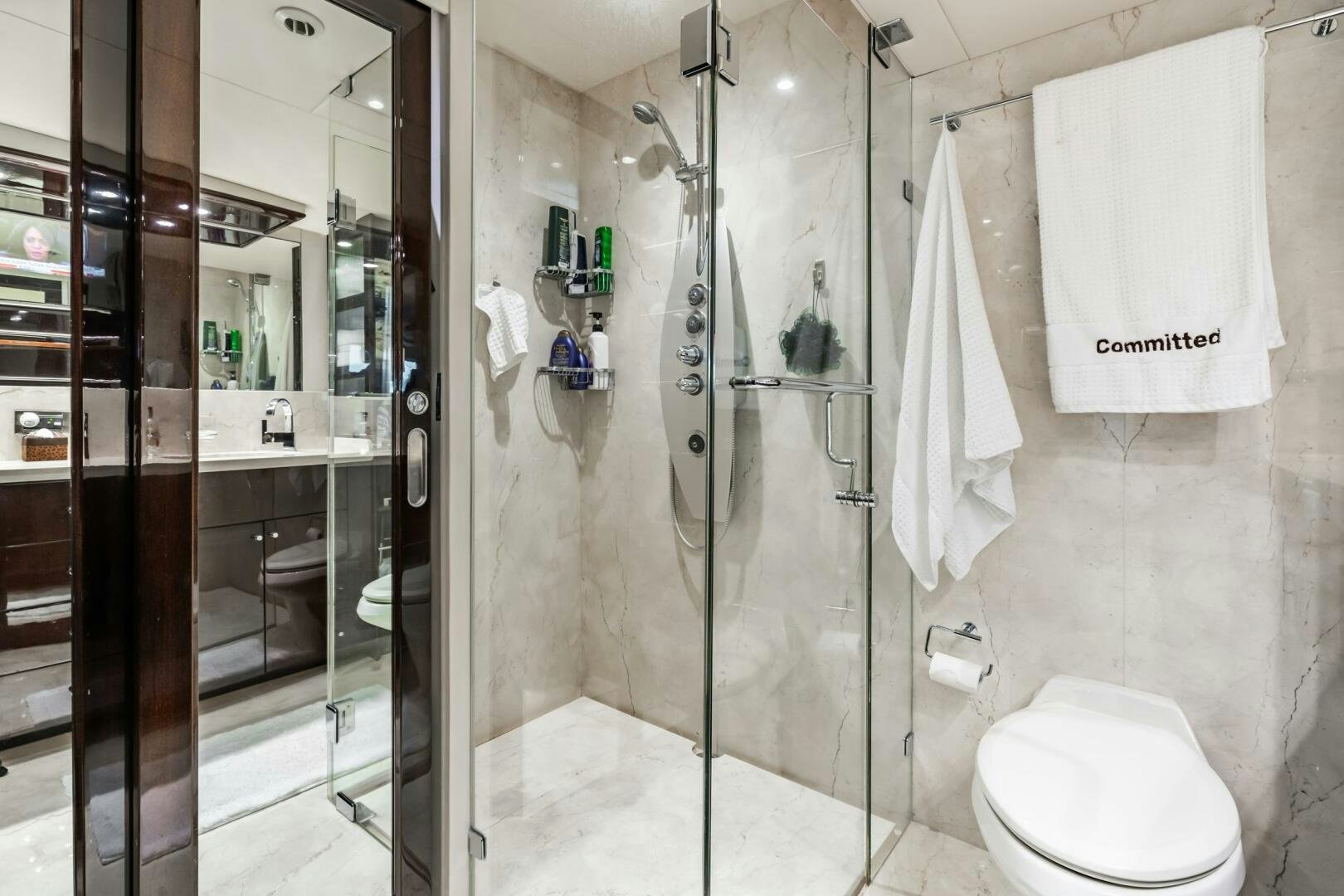 a bathroom with a shower unit aboard COMMITTED Yacht for Sale