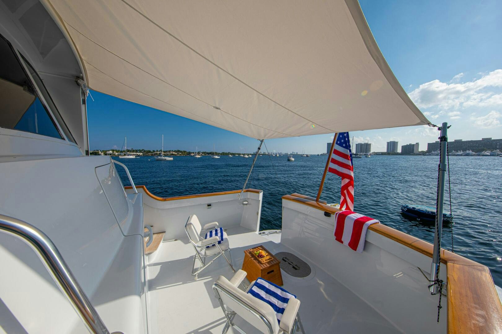 a boat with a flag on the front aboard KOALA Yacht for Sale