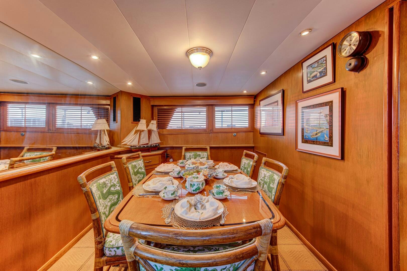a dining table in a house aboard KOALA Yacht for Sale