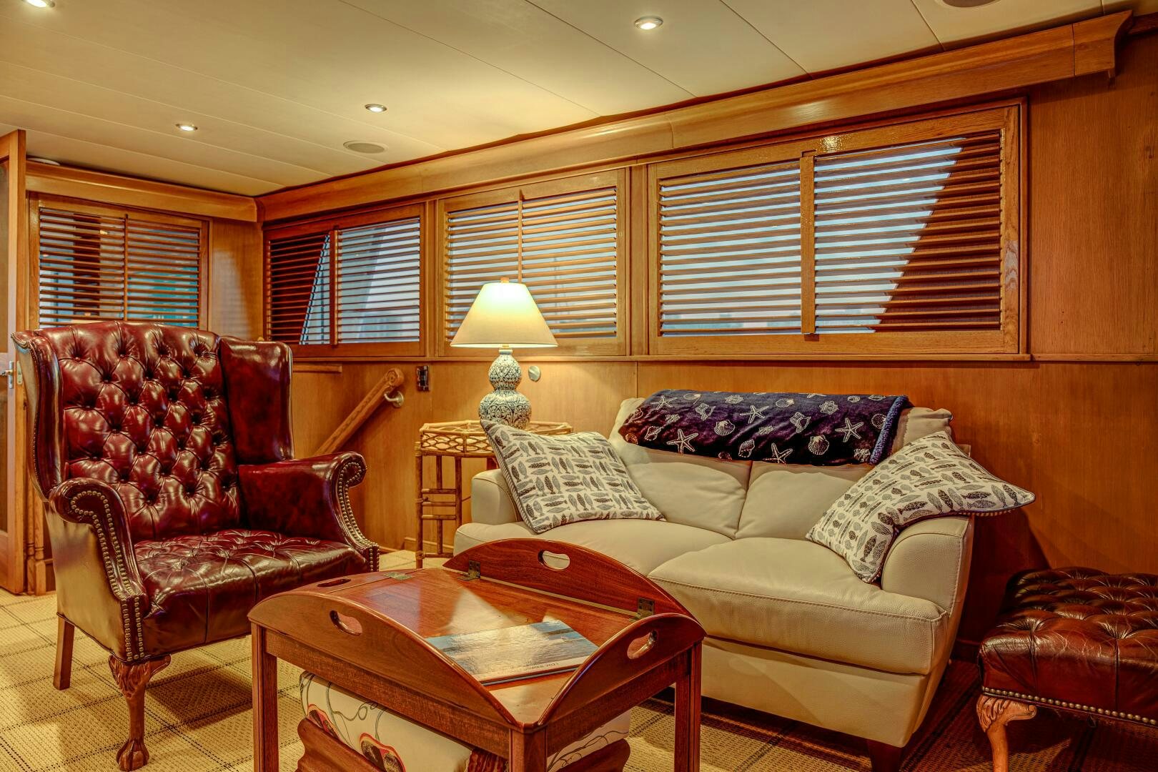 a living room with a couch and a coffee table aboard KOALA Yacht for Sale