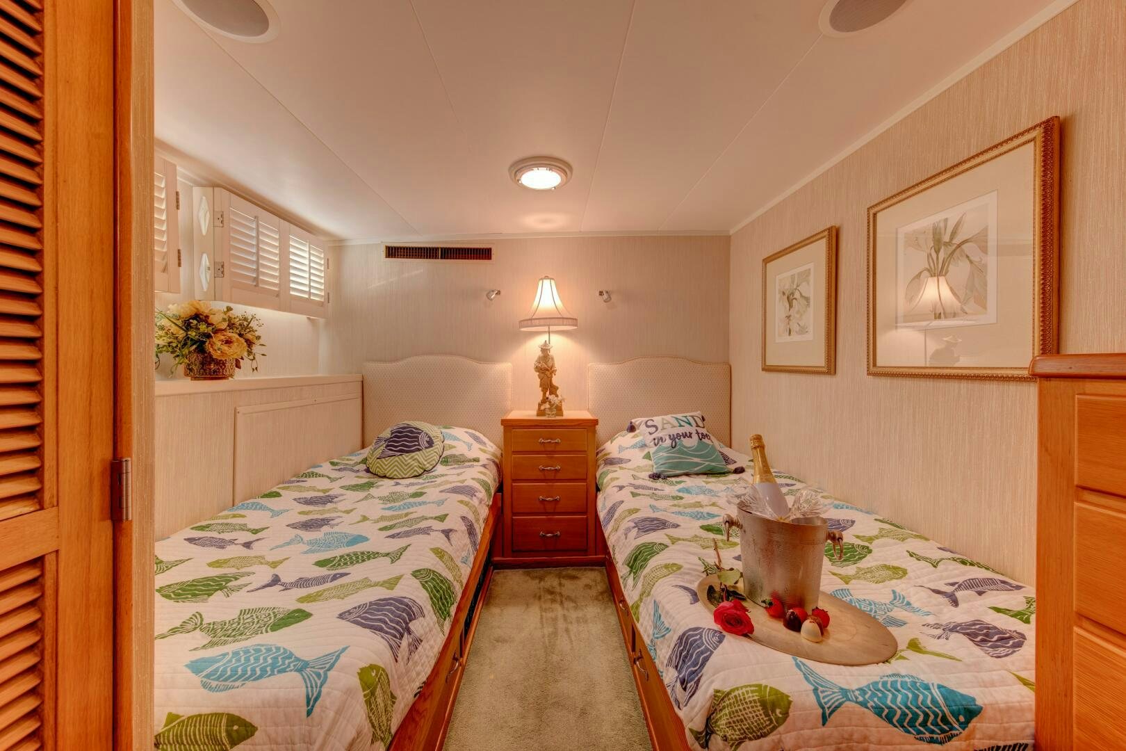 a bedroom with a couple beds aboard KOALA Yacht for Sale