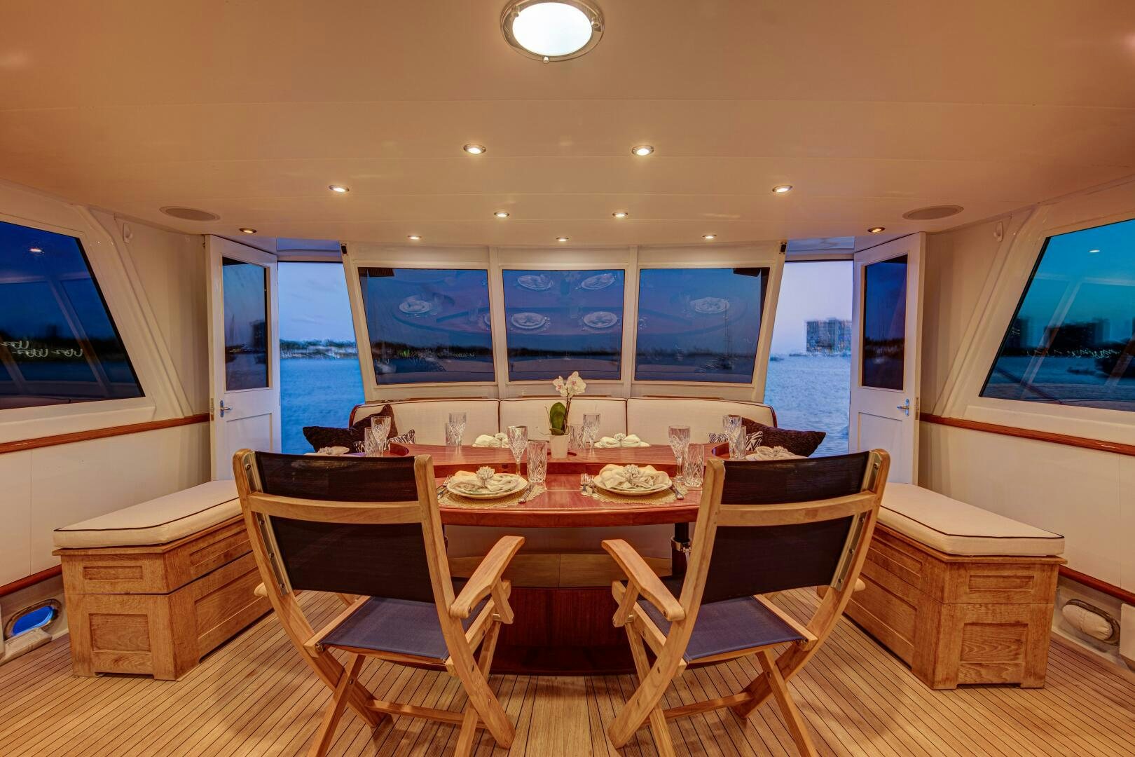 a dining room with a table and chairs aboard KOALA Yacht for Sale