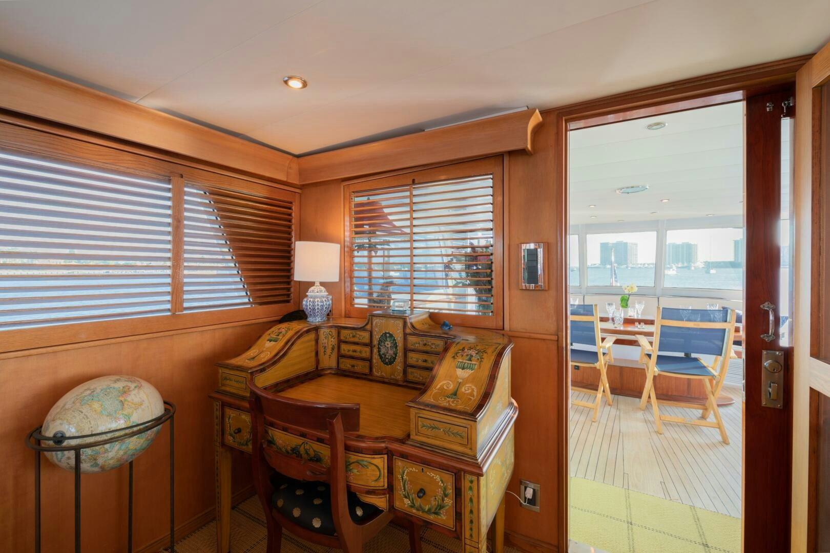 a living room with a dining table aboard KOALA Yacht for Sale
