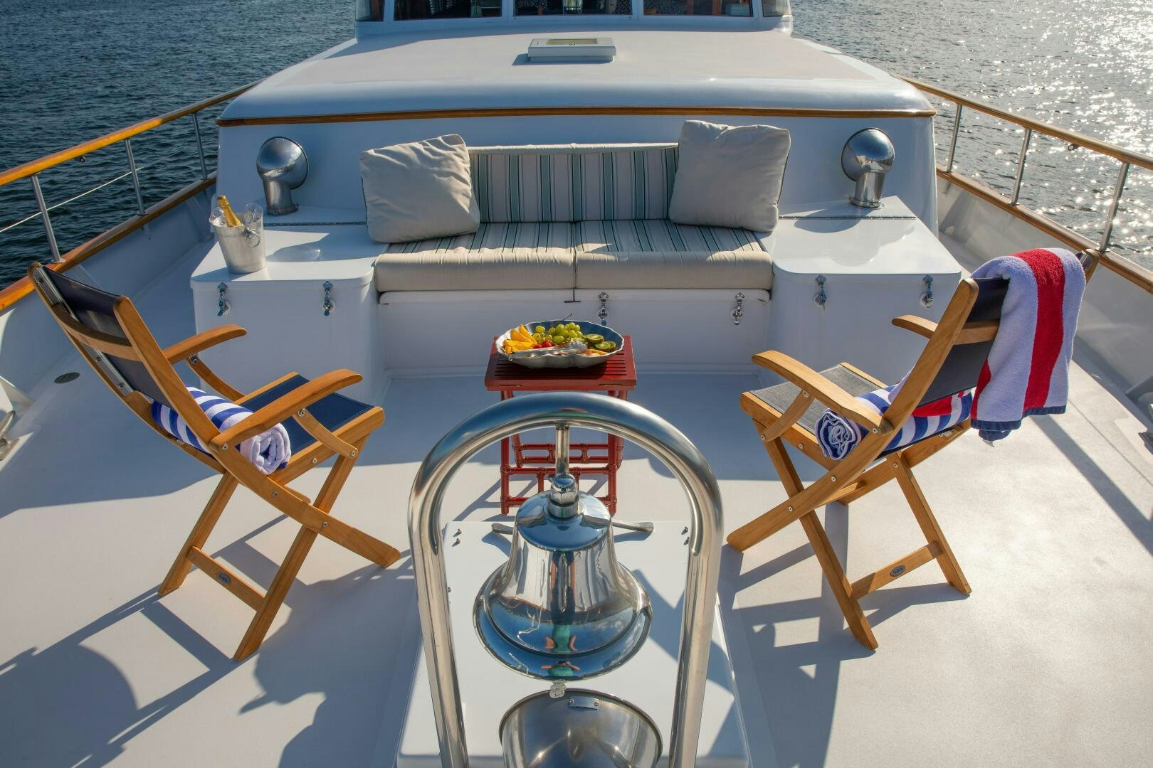 a boat with a table and chairs on the deck aboard KOALA Yacht for Sale
