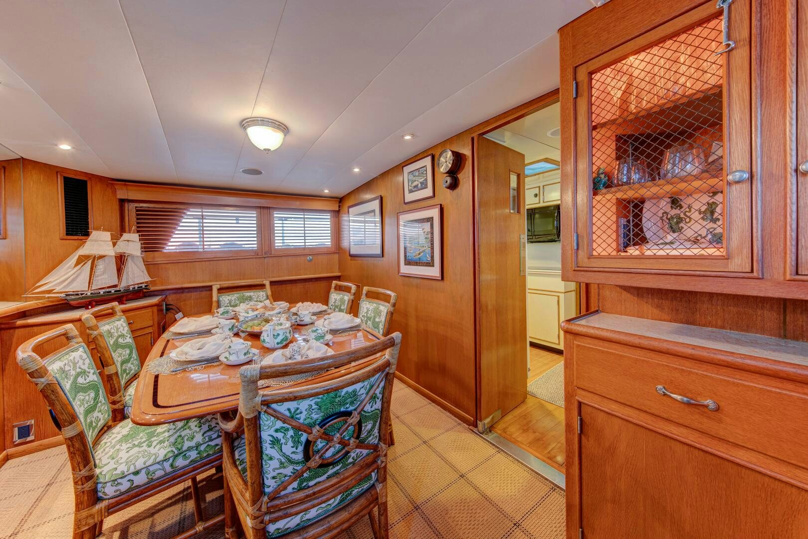 a dining room with a table and chairs aboard KOALA Yacht for Sale