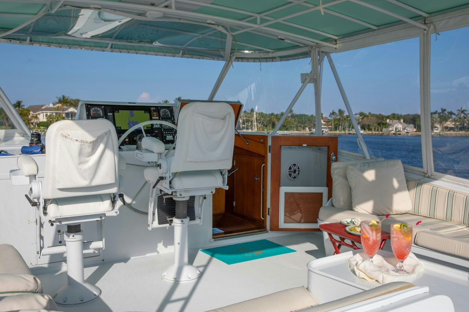 a boat with drinks and a chair aboard KOALA Yacht for Sale