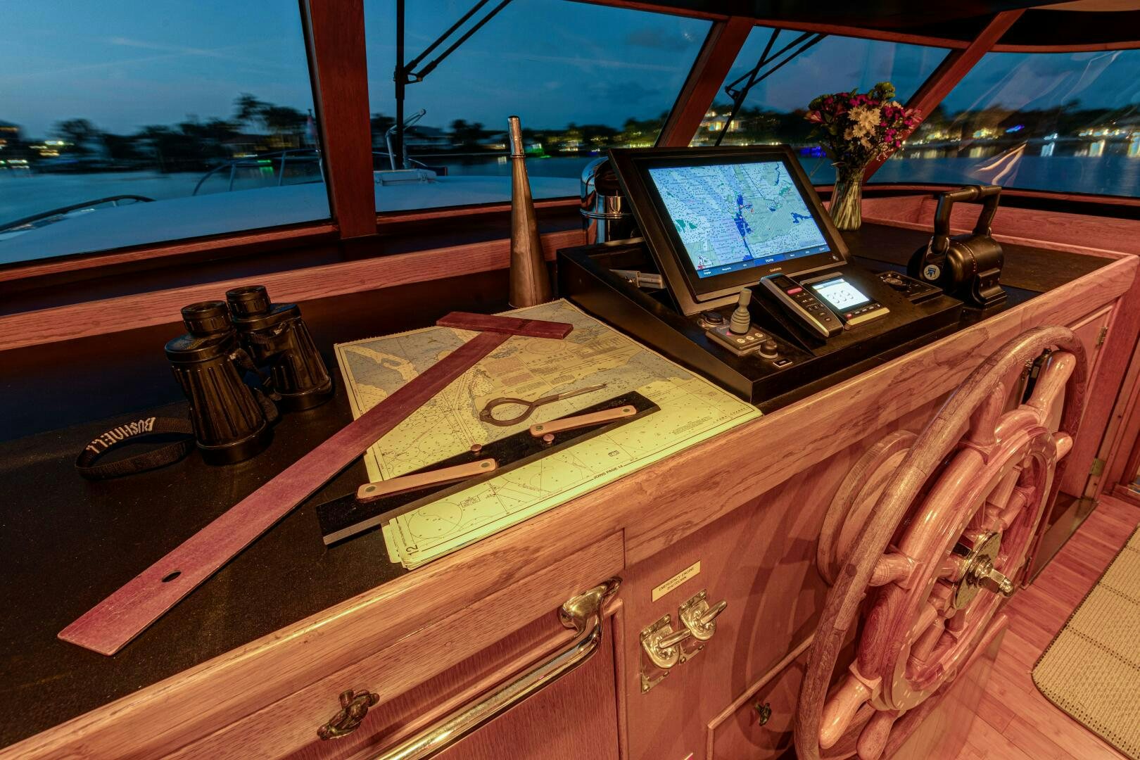 a wooden boat with a laptop on it aboard KOALA Yacht for Sale