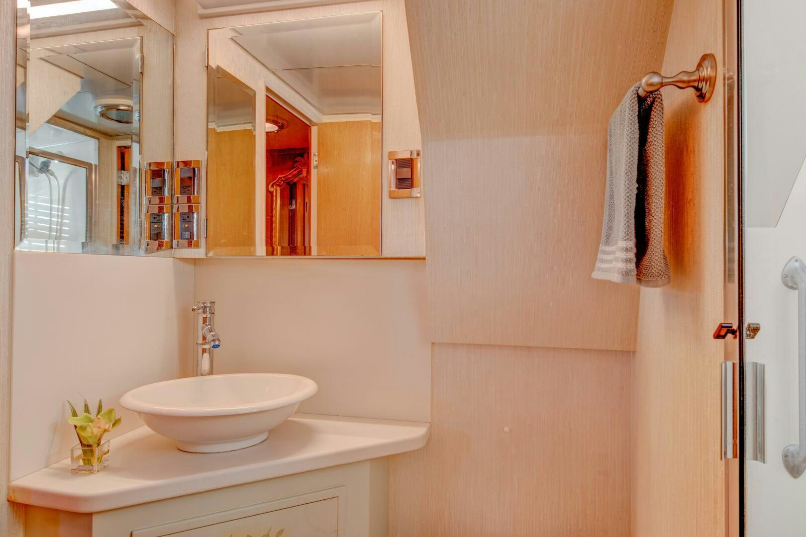 a bathroom with a sink and towels aboard KOALA Yacht for Sale